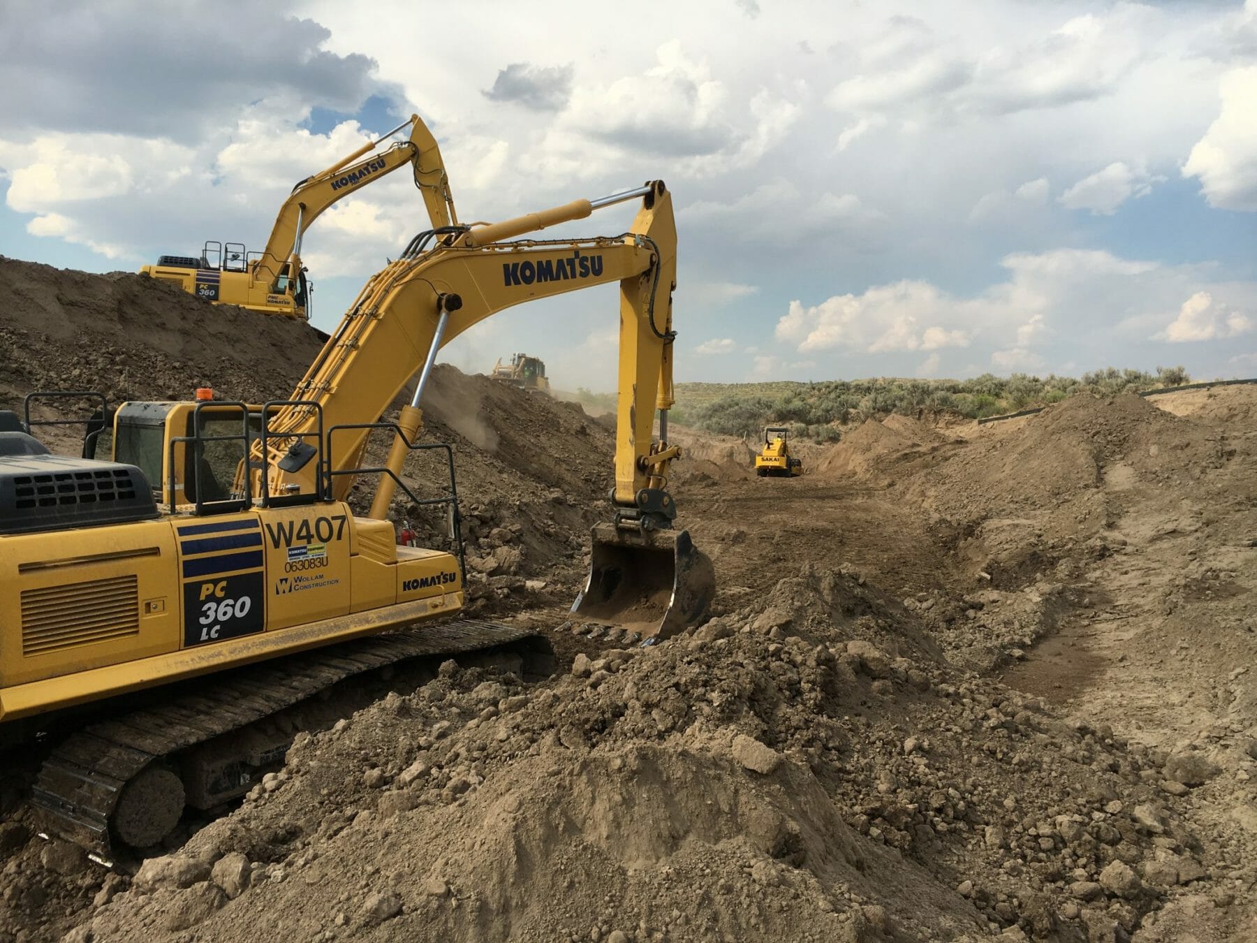 Trucks Working at Dirt Site