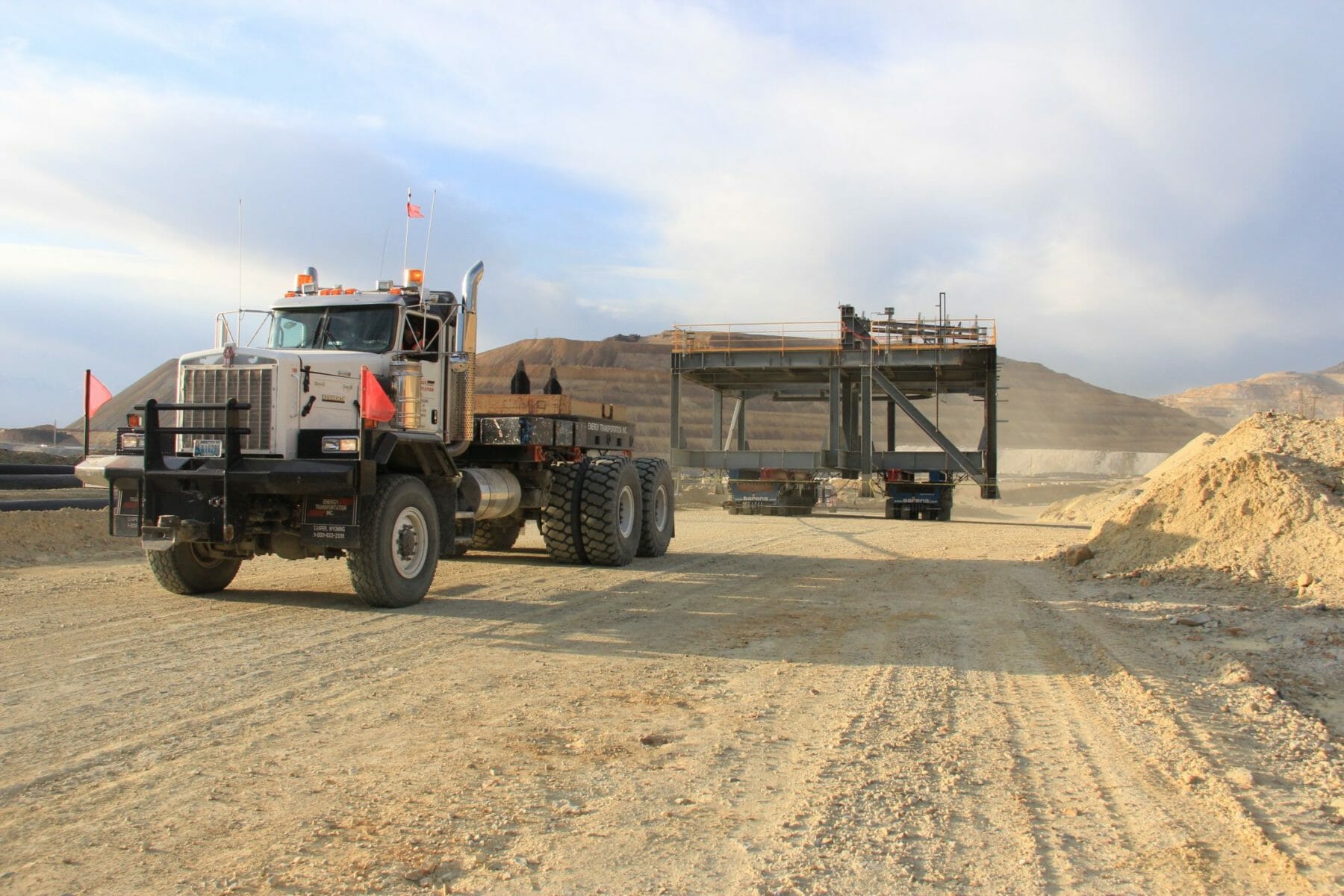 Trucks Moving Pre-Engineered Framing