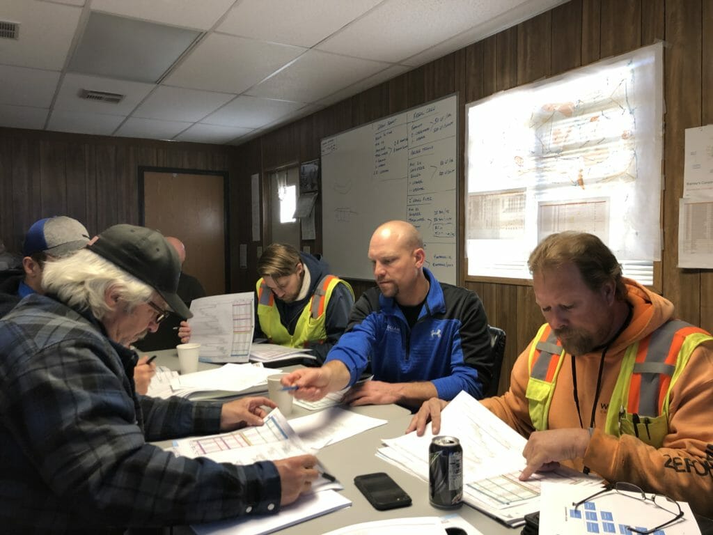 Construction Workers Meeting In Office